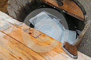 Wooden plank of an ancient washhouse with SOAP