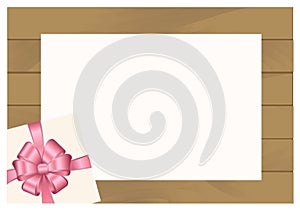 Wooden Plank Background with Pink sheet of paper and Square Gift Box with Red Bow.