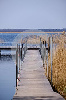 wooden plank foothpath boardwalk trampoline in the lake