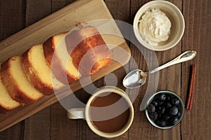 Wooden plank pound cake and coffee photo