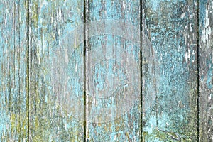 Wooden planks background with teal blue and yellow colored old weathered planks