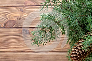 Wooden planks branch tree cone new year postcard background Christmas