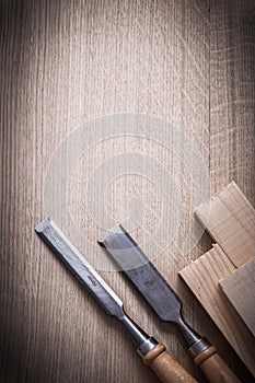 Wooden planks and firmer chisels on wood background copy space c