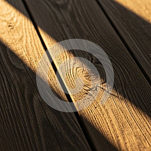 Is illuminated by sunlight, casting diagonal shadows across the