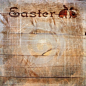 Wooden planks with stamping Easter, scratches and texture