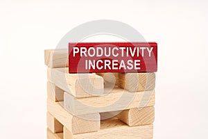 On the wooden planks there is a red one with the inscription - Productivity Increase