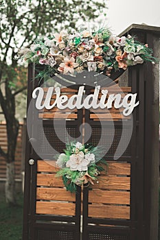 Wooden plaque with the inscription Wedding. Decorations photo