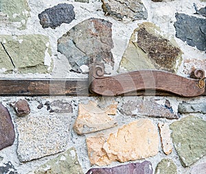 Wooden plaque stone wall