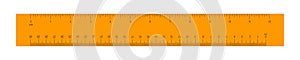 Wooden or plastic orange ruler with 12 inch and 30 centimeter scale. Distance, height or length measurement math tool