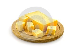 Wooden plate with cheese