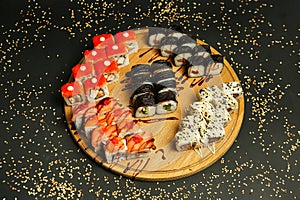 Wooden Plate Filled With Assorted Sushi Rolls