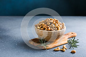 wooden plate filled with cashew nuts