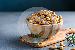 wooden plate filled with cashew nuts