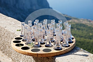 Wooden plate with strong sweet Croatian aperitif fruity drinks like slivovitz, kruskovac and rakija being served outside