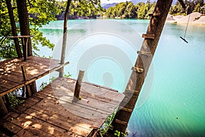 Wooden platform and a beautiful blue lake, playground