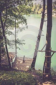 Wooden platform and a beautiful blue lake, playground