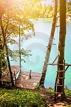 Wooden platform and a beautiful blue lake, playground