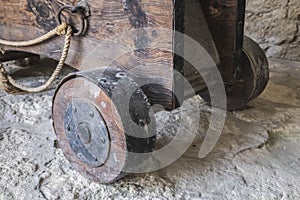 Wooden platform with wheels on which a medieval cannon is installed