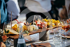 Wooden platter with gourmet appetizers on a restaurant table