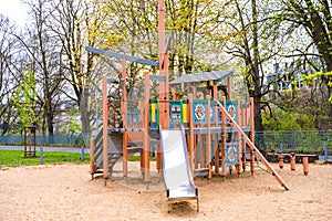 Wooden playground Ship with slide and sand in spring in Prague Liben