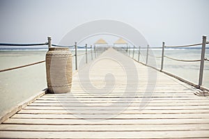 Wooden pontoon stretching into the Red sea