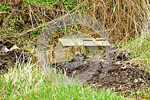 Wooden portbire box for artillery shells is forgotten on the grass.