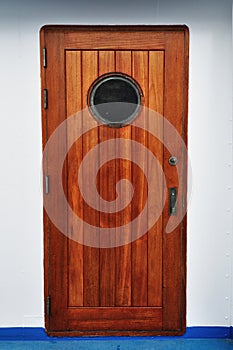 Wooden Porthole door in a ship/cruise.