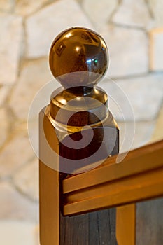 Wooden post on the bannister of a stairwell photo