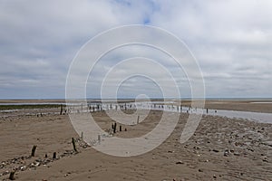 The wooden posts of a long abandoned berthing area for Vessels at the northern end of Montrose Beach,