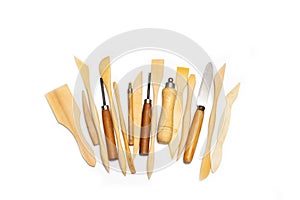 Wooden pottery spatulas, gouges and punches on a white background