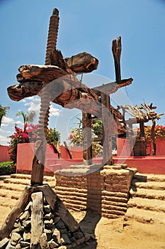 wooden press, detail the screw allows the bundle to fall to crush the grapes to extract the must and the wine ICA PERU
