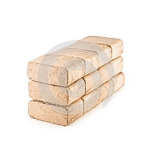 Wooden pressed briquettes from biomass on a white isolated background