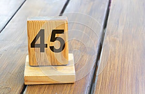 Wooden priority number 45 on a plank tab