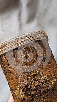 A wooden product decorated with jute rope