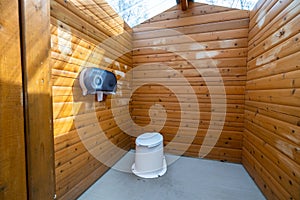 Wooden public lavatory in the Jasper National Park. Countryside toilet concept.