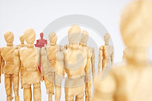 Wooden puppet, stands at the head of society. Leadership concept, winner, leader, influencer. Copy space, 3D illustration, 3D