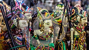 Wooden puppet with traditional batik fabrique called `wayang golek` from Java photo