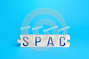 Wooden puzzle blocks with abbreviation SPAC Special purpose acquisition company. Simplified listing of company, merger bypassing