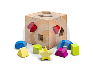 Wooden puzzle box toy with colorful blocs isolated on white with clipping path photo