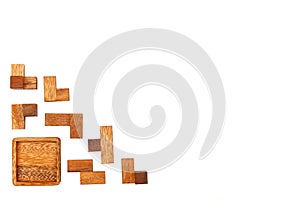 A wooden puzzle is a cube. Isolated on white background. Close-up