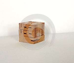 Wooden puzzle located on a light background