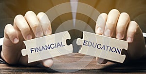 Wooden puzzles with the words Financial education. Learn investing and money management. Business and finance concept. Development