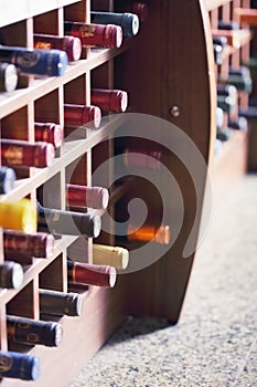 Wooden rack with wine bottles
