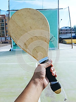 Wooden racquet for Fronton game, one-handed racquet with bottom of the wall to play fronton.