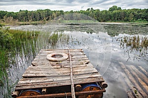 Wooden raft on the lake