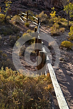 Wooden rail fence in desert landscape