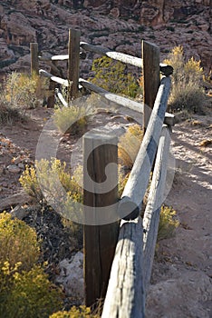 Wooden rail fence in desert landscape