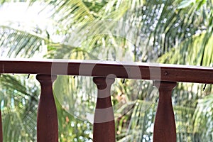 Wooden railing of the balcony with Christmas lights in a tropical place Ari Atoll,Maldives