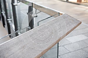 Wooden railing with tempered glass.