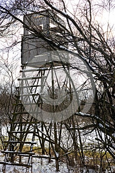 wooden raised hide for hunting in thuringia in winter